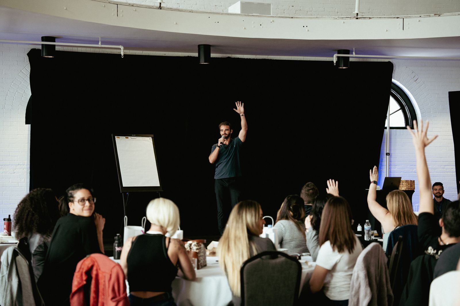 Joshua speaking on stage